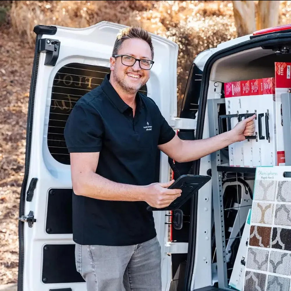 Employee standing in front of van