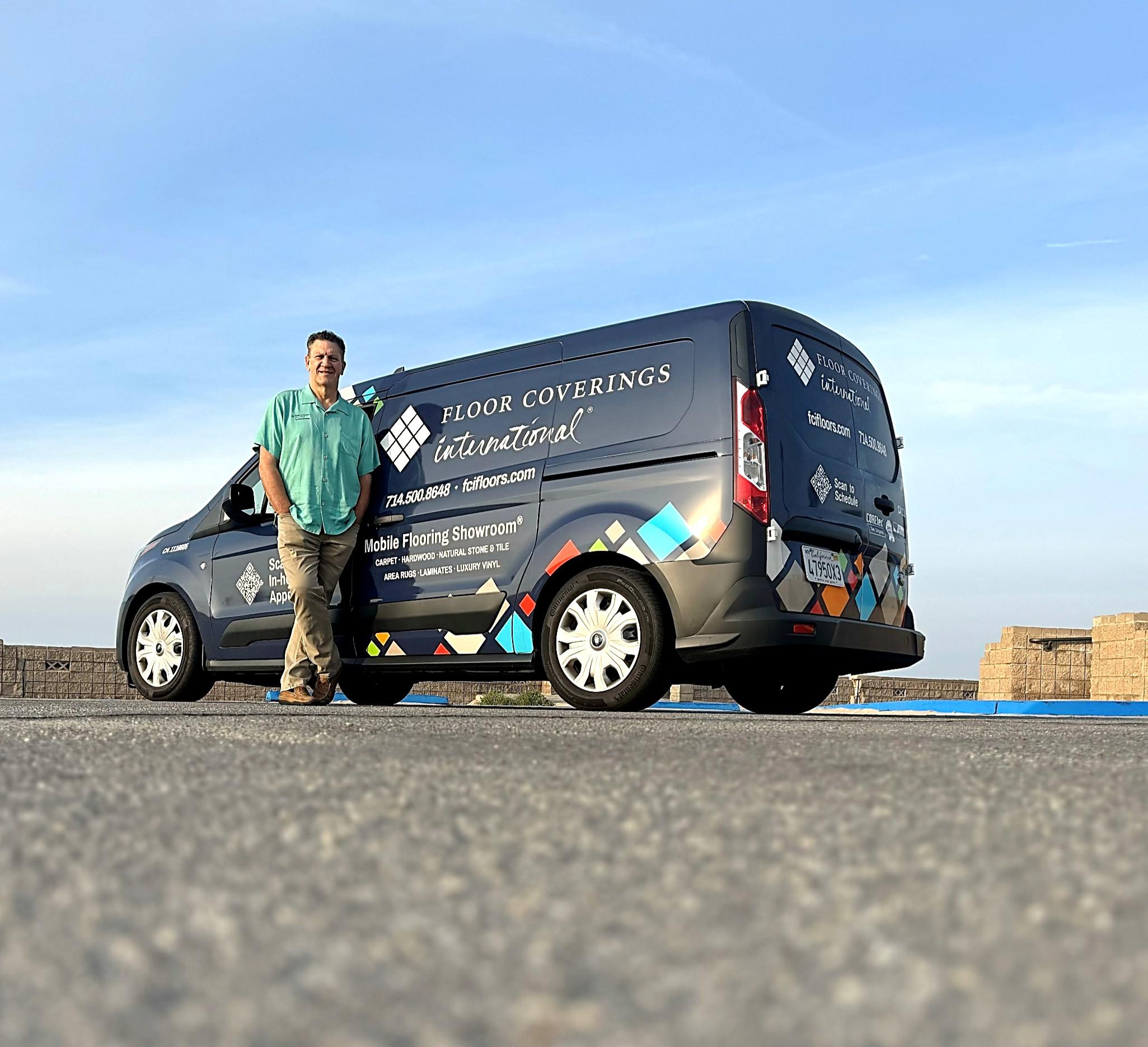 Randy Thomas standing in front of FCI mobile showroom