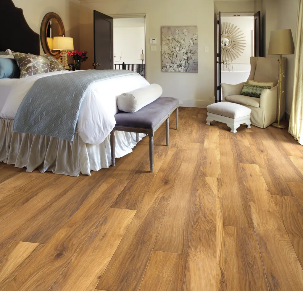 Bedroom with brown laminate flooring