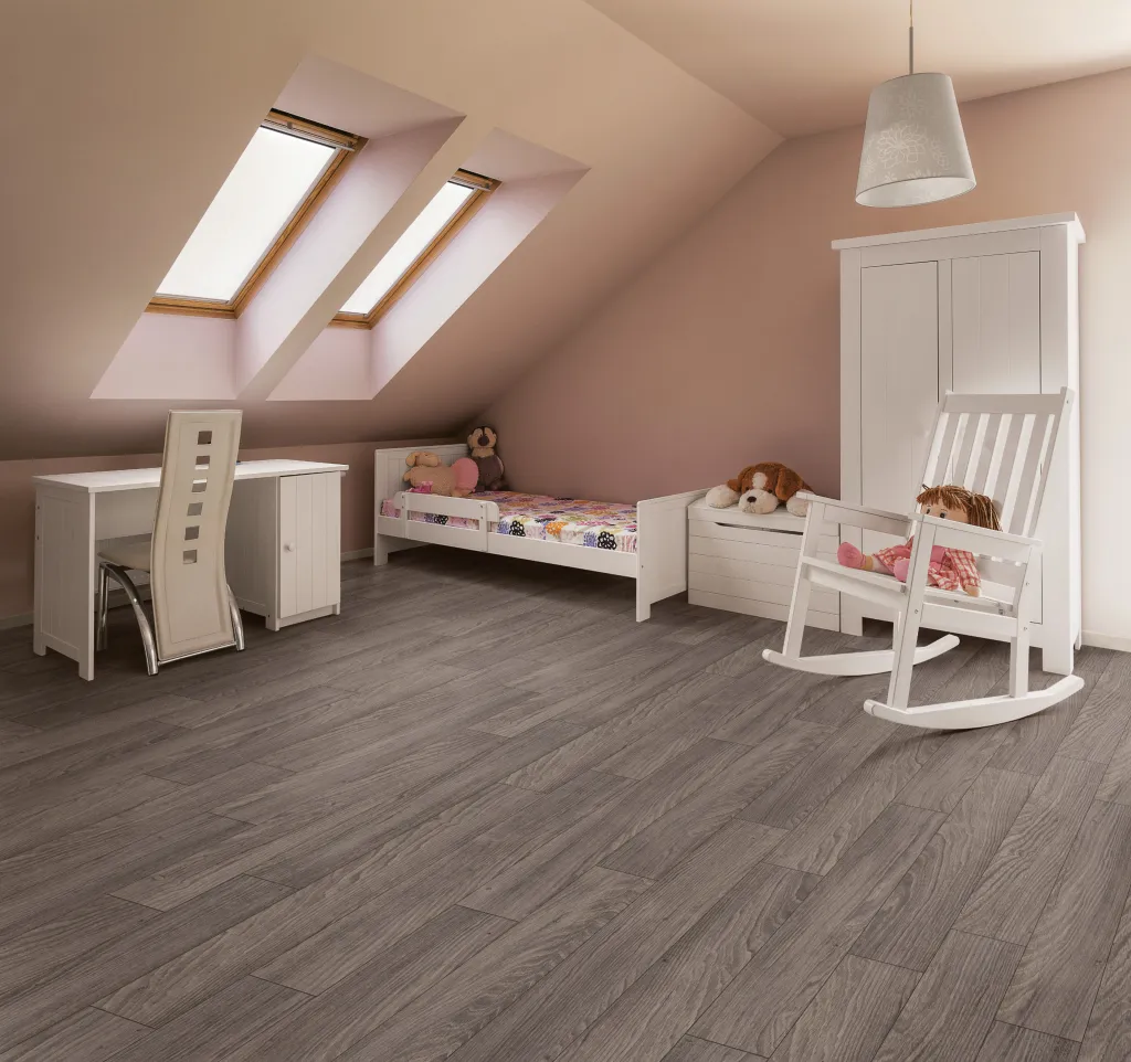 a child's room with grey vinyl flooring
