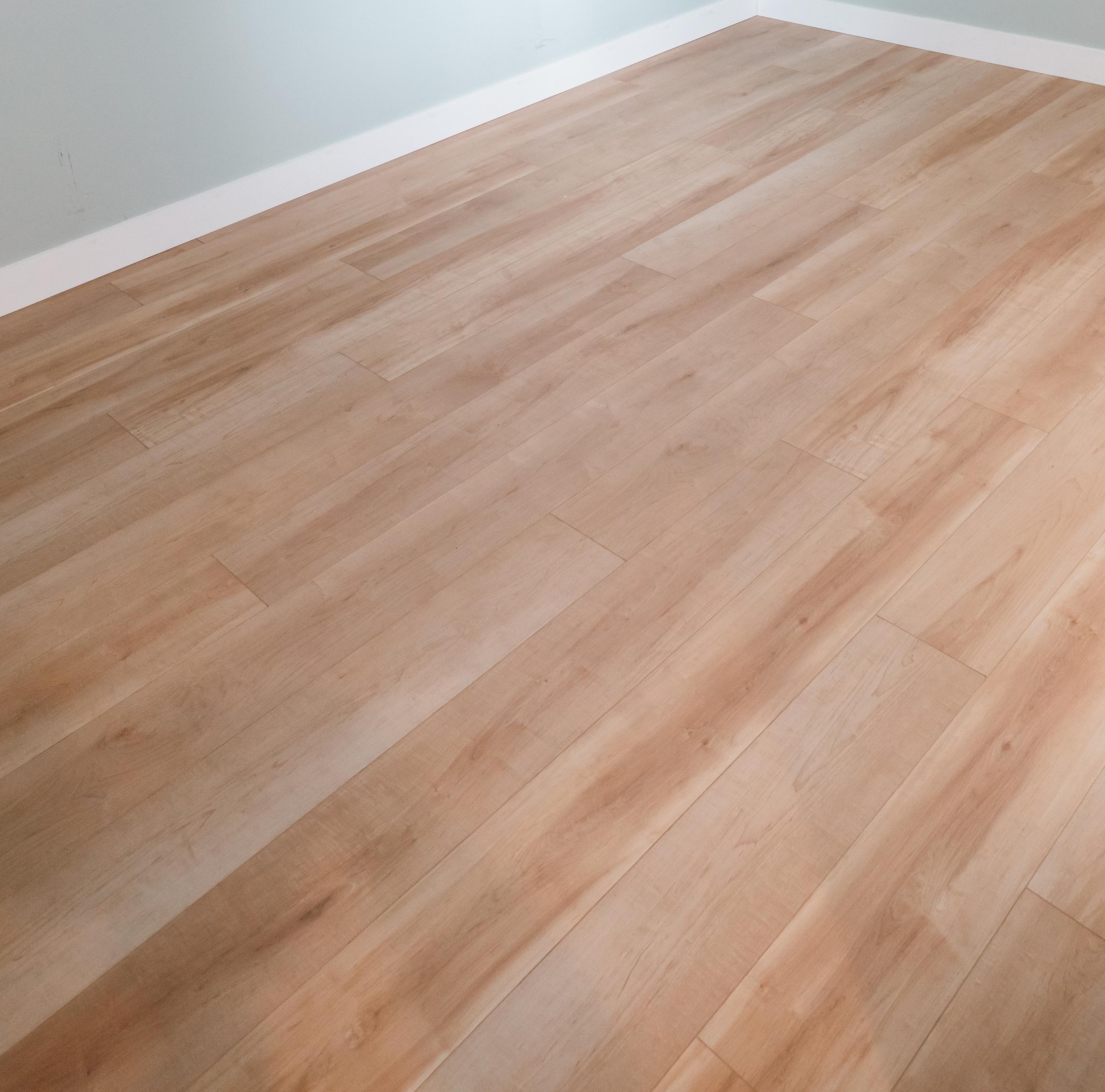 Close-up of laminate flooring showing realistic wood grain and texture.